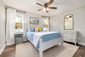 a bedroom with a bed and a ceiling fan at Nora Mill in Helen