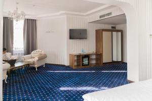 TV a/nebo společenská místnost v ubytování Hotel Khanaka