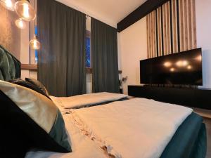 Postel nebo postele na pokoji v ubytování Apartment House Nová Dubnica