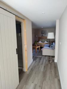 a room with a bedroom with a bed and a door at Southwell Home Stay in Southwell