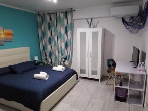 Łóżko lub łóżka w pokoju w obiekcie Casa Mia