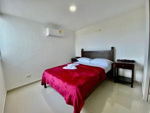 Una cama o camas en una habitación de Coveñas apartamento amoblado piso 1 19 fotos más