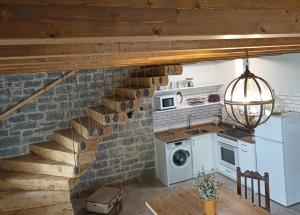 a kitchen with a staircase and a washing machine at Alto el Monte 2 - AR1414 in Bocines