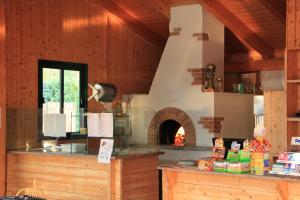 a kitchen with a large oven in a building at Dkamping Village in Ispra