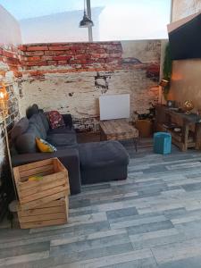 Posezení v ubytování Dormir à l'usine Loft industriel Atypique