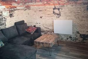 Posezení v ubytování Dormir à l'usine Loft industriel Atypique