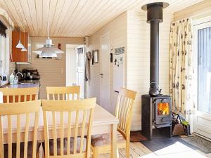 A restaurant or other place to eat at 4 person holiday home in Store Fuglede