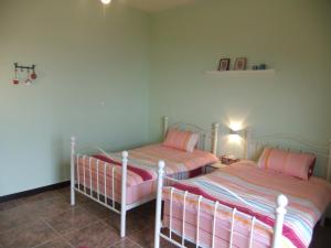 Postel nebo postele na pokoji v ubytování Jiufen Hui Ming Homestay