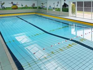 a large swimming pool with a lanespect at Apartment Vestervig III in Vestervig
