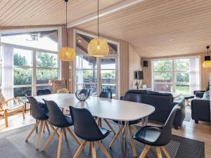 a dining room with a table and chairs at 8 person holiday home in Fjerritslev in Fjerritslev