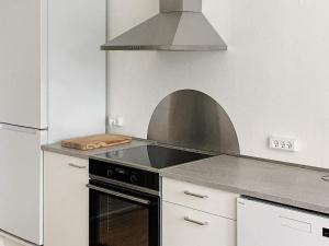 a kitchen with a stove and an oven in it at 4 person holiday home in Nakskov in Nakskov