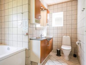 a small bathroom with a sink and a toilet at Holiday home Nørre Nebel CXLII in Nørre Nebel
