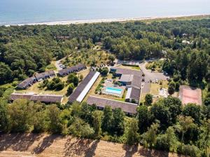 an aerial view of a resort with a pool and trees at Holiday home Nexø XLI in Neksø
