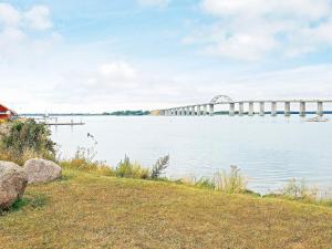 eine Brücke über einen großen Wasserkörper in der Unterkunft 4 person holiday home in Rudk bing in Rudkøbing