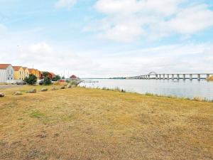 a large body of water with a pier at 4 person holiday home in Rudk bing in Rudkøbing