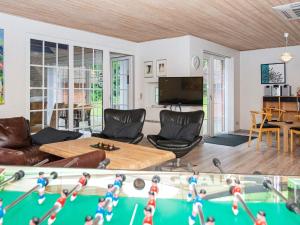 a living room filled with furniture and a table at 12 person holiday home in Ulfborg-By Traum in Ulfborg