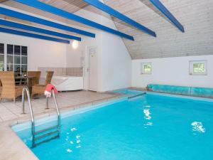 a swimming pool in a house at 12 person holiday home in Ulfborg-By Traum in Ulfborg