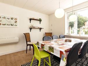 a dining room with a table and chairs at 6 person holiday home in S by r in Søby
