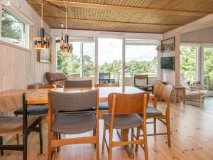 a dining room with a table and chairs at 7 person holiday home in Knebel in Knebel