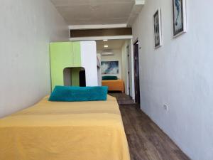 מיטה או מיטות בחדר ב-Casa Bajo Congo