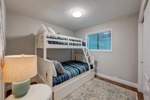 a bedroom with two bunk beds and a lamp at Casa Azul in Incline Village