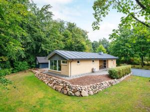 a tiny house with a rock perimeter at Three-Bedroom Holiday home in Aabenraa 1 in Loddenhøj