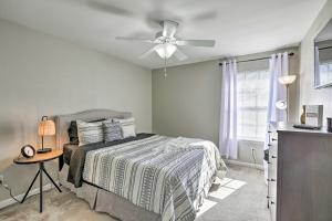 a bedroom with a bed and a ceiling fan at Sleek Tallahassee Family Home - 5 Mi to Dtwn! in Tallahassee