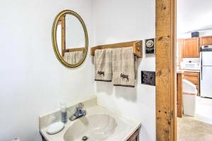 a bathroom with a sink and a mirror at Cozy North Conway Home Walk to Slopes and Dtwn in North Conway +22 photos