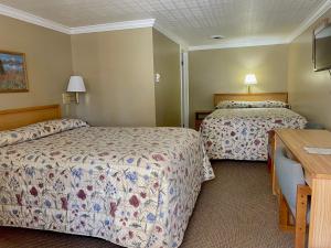 Postel nebo postele na pokoji v ubytování Greybull Motel