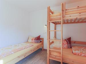 Łóżko lub łóżka w pokoju w obiekcie Haus Fabian