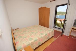 Posteľ alebo postele v izbe v ubytovaní Apartment Vis 8448a