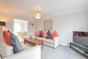 a living room with two couches and a coffee table at Number 51, Halesworth in Halesworth