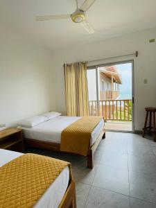 Voodi või voodid majutusasutuse Samana Hostal, Puerto Engabao toas