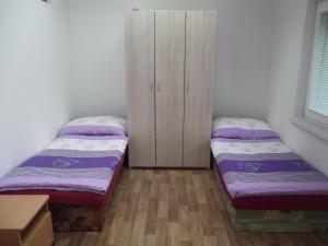 Postel nebo postele na pokoji v ubytování Penzion Apartmány Zlín