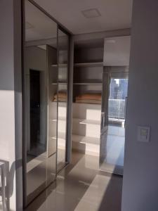 a room with a large glass closet with a window at TORRE GUAYASAMIN in Corrientes