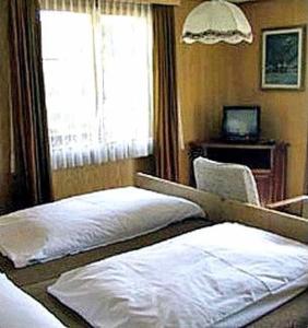 Letto o letti in una camera di Hotel Cima