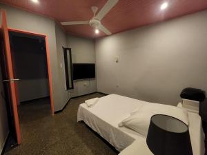 Postel nebo postele na pokoji v ubytování Fardo Hotel Boutique en Ibague - Zona G - Recepción Digital 24H