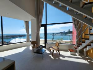 a living room with a view of the water at Bau Haus in Sokcho