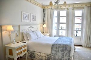 Giường trong phòng chung tại Il Campanario - Cobertura +29 ảnh