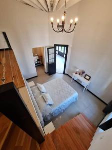 a living room with a couch and a table at Lechuza Bolivar in San Antonio de Areco +40 photos