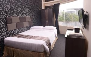 Llit o llits en una habitació de DS Colive Sinabung