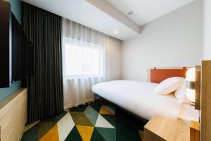 Postel nebo postele na pokoji v ubytování JR-East Hotel Mets Omori + 37 fotografií