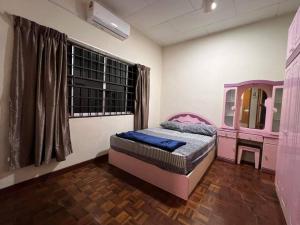 Ένα ή περισσότερα κρεβάτια σε δωμάτιο στο PD Villa 12 Homestay