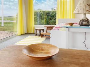 a wooden bowl sitting on a wooden floor in a room at Holiday home Aabenraa LXIII in Aabenraa