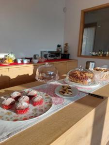 a table with two plates of food on top of it at La casa di Maia - Alloggio Agrituristico in Pedavena