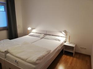 a bedroom with two beds and a window at Barrierefreies Appartement auf der Alb in Trochtelfingen