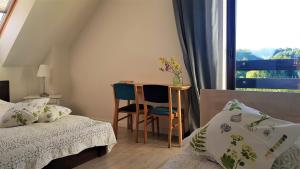 Postel nebo postele na pokoji v ubytování Siedlisko Gregorowo + 37 fotografií