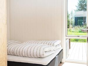 Postel nebo postele na pokoji v ubytování Holiday home Glesborg CXXXII