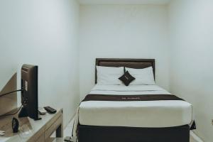 Postel nebo postele na pokoji v ubytování DS Colive Siliwangi + 7 fotografií