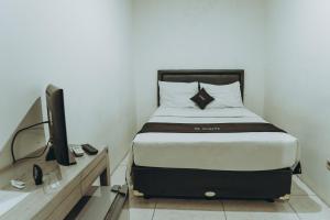 Letto o letti in una camera di DS Colive Siliwangi